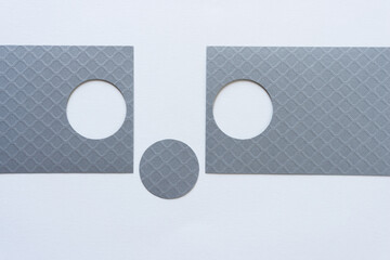 silver paper with circle shapes on a light background