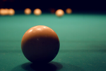 Photo of a billiard ball on a green cloth