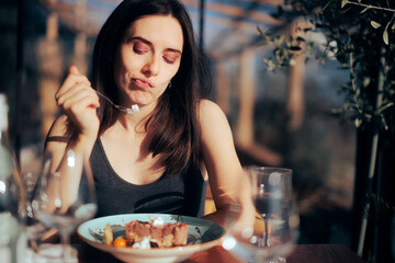 Woman Unhappy with Her Dessert Eating in a Restaurant - obrazy, fototapety, plakaty