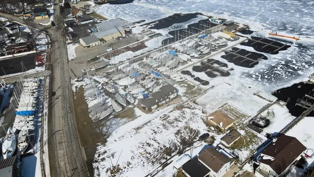 Still video of the winterized boats in a marina on Muskegon Lake.