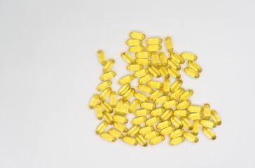 Cod liver oil omega 3 gel capsules on white background