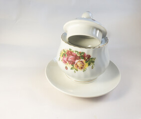 porcelain sugar or salt pot on a plate