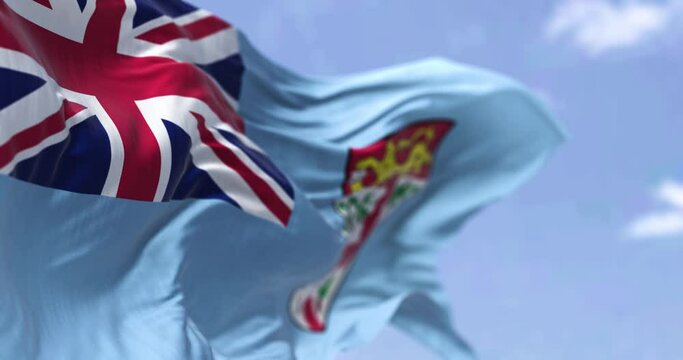Detail of the national flag of FIji waving in the wind on a clear day