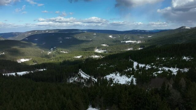 Forest mountain hill snow winter Beskydy spruce drone aerial video shot Picea abies forest virgin of a beech Fagus sylvatica, quadcopter view flying fly flight show, covered large layer, dry stumps