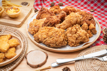Fried chicken in wooden plate on wooden background, Deep fry Chicken on wooden table.