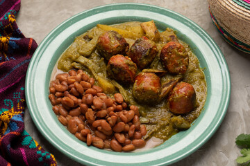 Chorizo stew with green sauce and nopal cactus. Mexican food