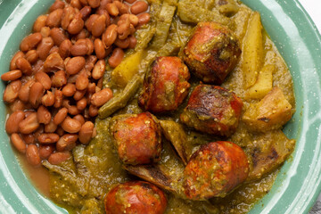 Chorizo stew with green sauce and nopal cactus. Mexican food
