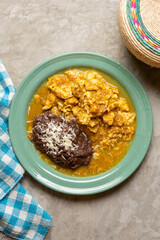 Scrambled eggs with red sauce and beans. Mexican food