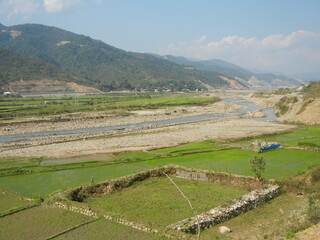 Mountains on Vietnamese-Lao boarder and a river and fields inside Vietnam near Dien Bien Rhu 