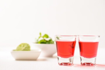 Red tequila with lime and mint on white background, Tropical spring and summer vacation concept