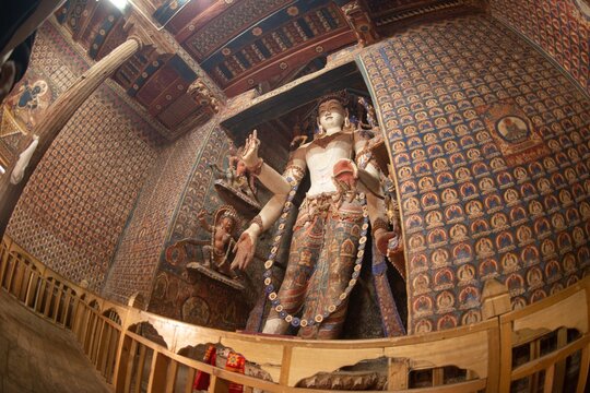 Large standing Buddha in Alchi Monastery or Alchi Gompa at Ladakh , India .