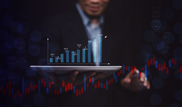 Businessman using smartphone or Tablet trading online in bitcoin forex stock market and other ETH NFT token cryptocurrency