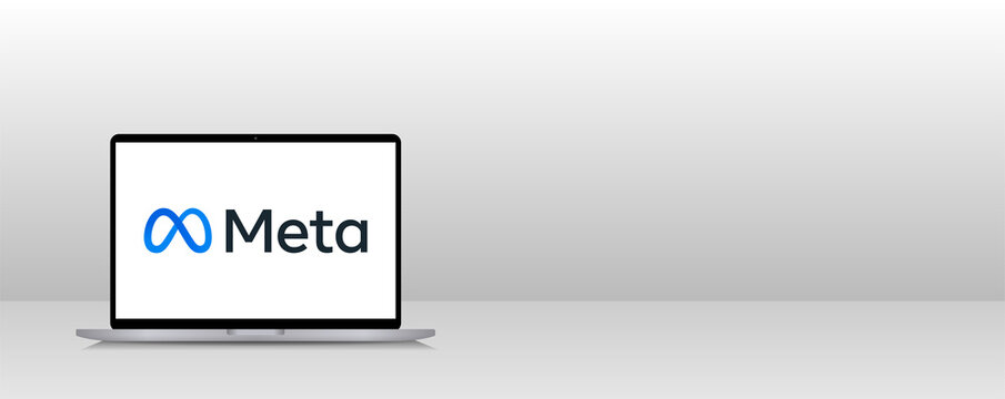 Meta editorial symbol on modern laptop design.