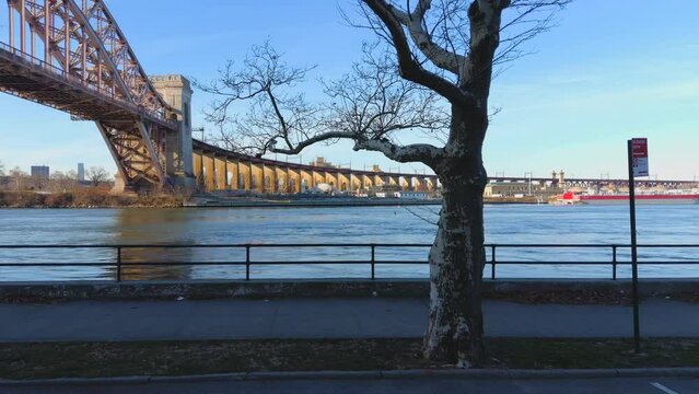 Aerial Trucking Shot of the Hell Gate Bridge and the East River - Part 3