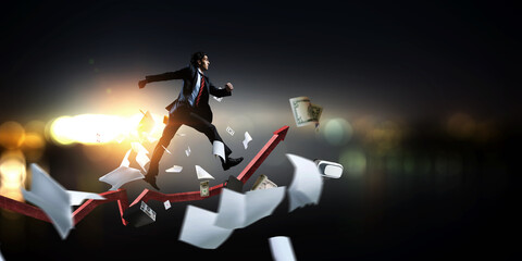 Portrait of energetic businessman running