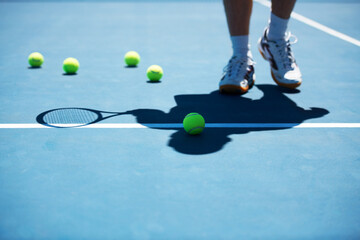 Practice makes perfect. Shot of a man unidentified man standing on a tennis court.