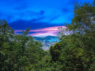 Colourful Sunset Patong Beach lovely vibrant orange, pink and Blue colours Phuket Thailand Thai 