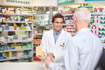This is exactly what you need. Cropped shot of a handsome young male pharmacist helping a customer in the pharmacy.