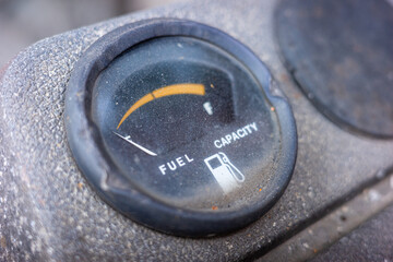 Close focus on emty fuel gauge meter.