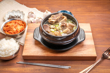 Beef bone soup or Seolleongtang The Most COMFORTING Korean food Served with kimchi, steamed rice, a popular Korean dish.