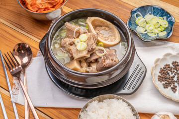 Beef bone soup or Seolleongtang The Most COMFORTING Korean food Served with kimchi, steamed rice, a popular Korean dish.