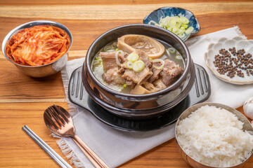 Beef bone soup or Seolleongtang The Most COMFORTING Korean food Served with kimchi, steamed rice, a popular Korean dish.