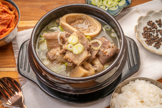 Beef bone soup or Seolleongtang The Most COMFORTING Korean food Served with kimchi, steamed rice, a popular Korean dish.
