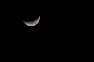 Obraz na płótnie Canvas Crescent moon in the dark night sky