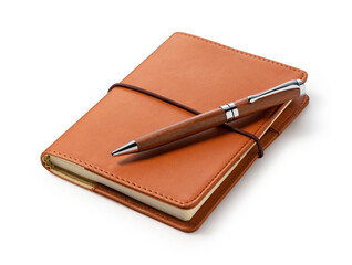 A leather notebook and pen set against a white background. - Powered by Adobe