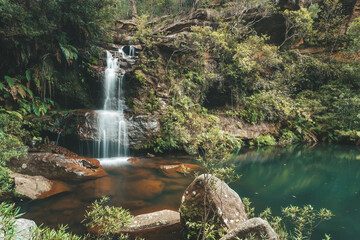 Tranquil waterfall and rock pool swimming hole in lower Blue Mountains
