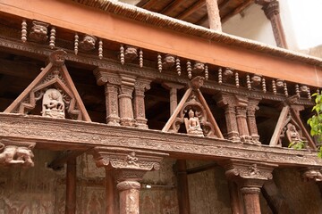 Ancient wooden carving on the entrance to Alchi monastery in Ladakh, India. Alchi monastery is a famous Buddhist temple near Leh, Ladakh,  India..