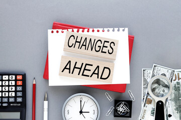 Changes ahead text on wooden blocks on a notepad. business concept