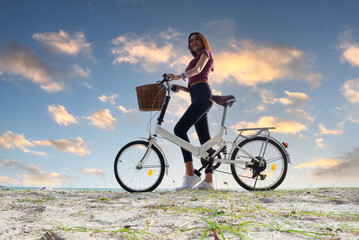 woman bicycling chill and relax at the beach. Lifestyle Concept.