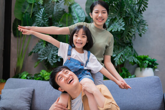 Portrait of young Asian family