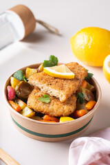 Vegan Plant based fish with crispy batter and roasted vegetables