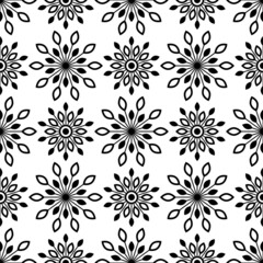 Floral Seamless pattern texture with black ethnic flowers. Geometric blooms. ornament for printing on fabric, paper or wrapping