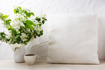 Pillow mockup with apple blossom and cup of coffee
