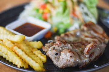 Pork neck steak on a plate ready to eat