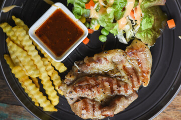 Pork neck steak on a plate ready to eat