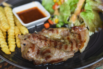 Pork neck steak on a plate ready to eat