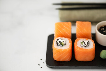 sushi with fresh salmon, cream cheese and cucumber