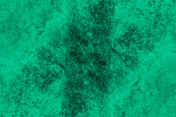 Green painted old concrete wall with dark grunge texture for background