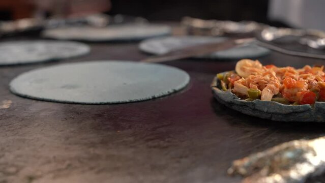 A piece of delicious gringas, typical Mexican food, in the street market in Mexico, Guerrero, Taxco