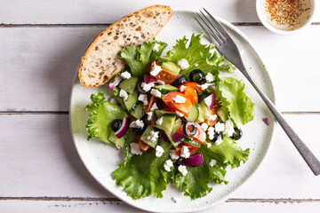 Plate with greek salad for dinner
