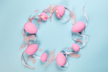 Pink Easter eggs on a blue background