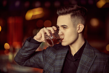 drinking whiskey in bar