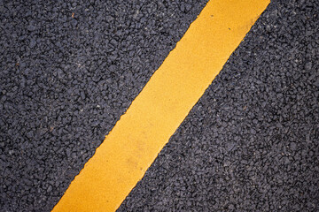 Fototapeta premium New asphalt road surface with yellow line background