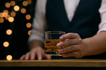 Barman pouring whiskey whiskey glass beautiful night