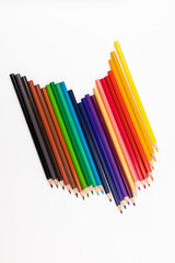 Many multicolored pencils, isolated on white background with copy space. Art and education background.