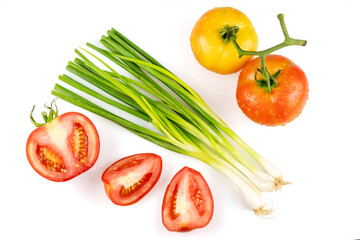 Leek spring onion and sliced tomatoes isolated on white background with clipping path